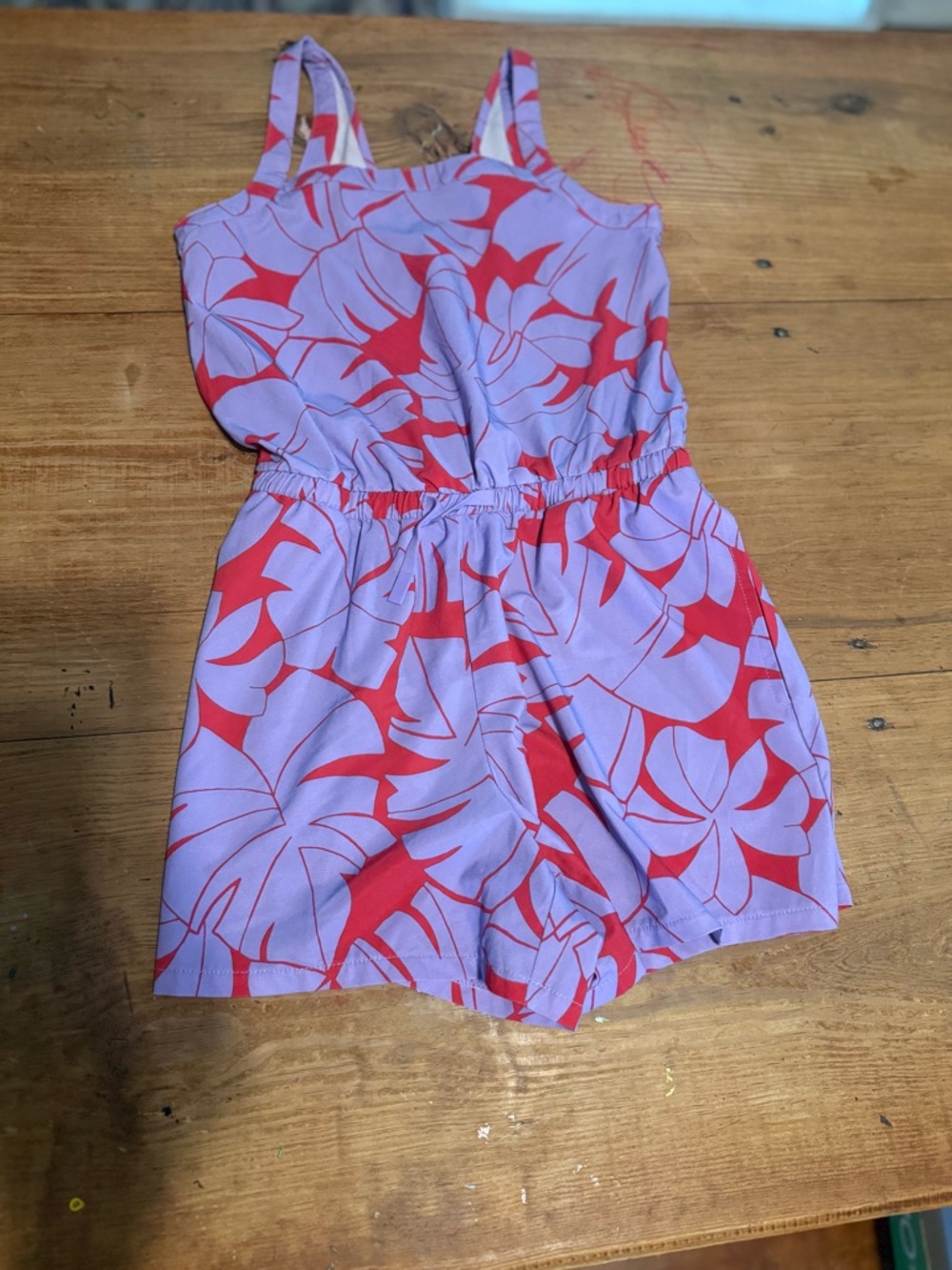 all in motion Lilac Romper with Red Floral Accents
